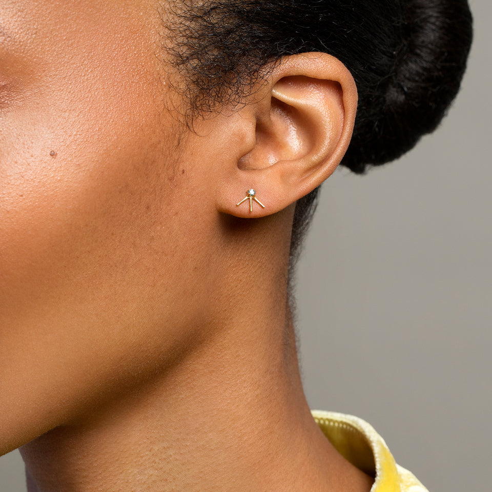 product_details::Aquamarine Sun Ray Stud Earring Single on model.