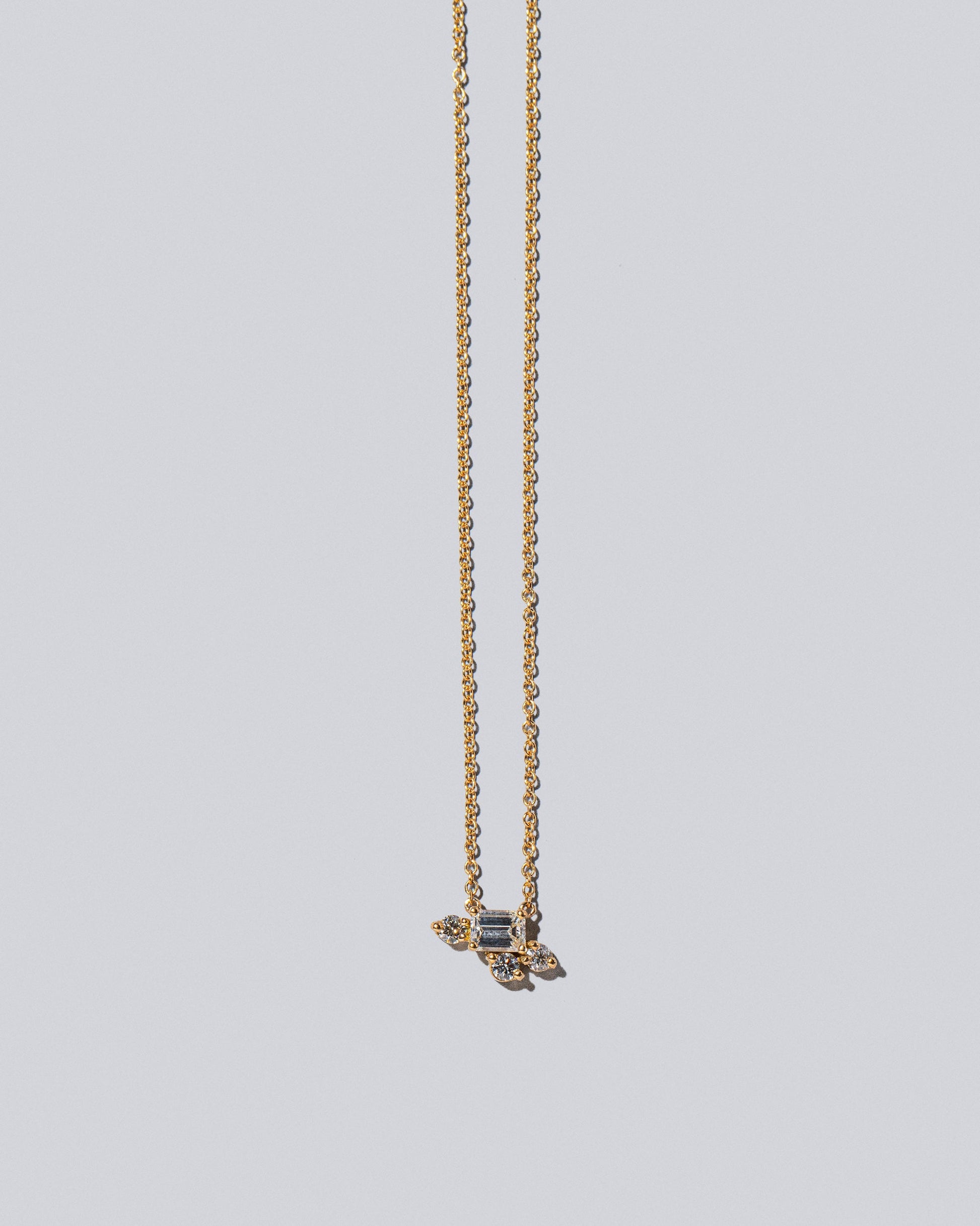 Cosmic Dawn Necklace - White Diamonds on light color background.