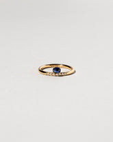 Stacked Ring - Sapphire & White Diamond on light color background.