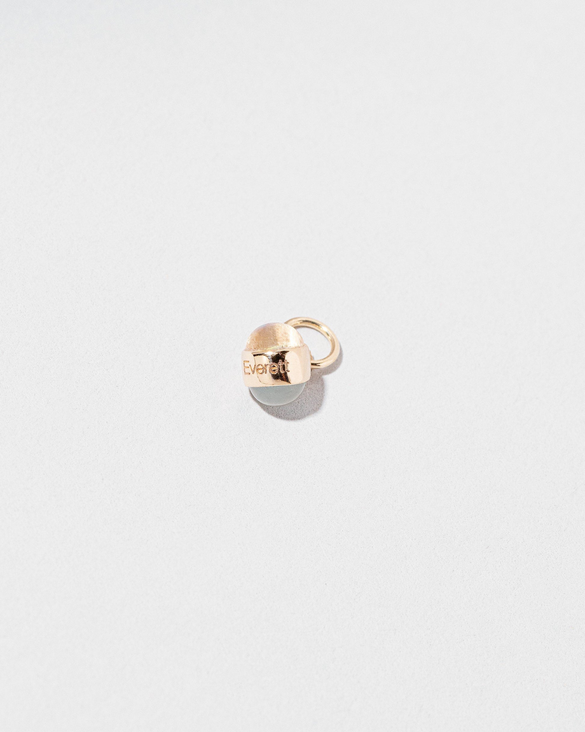 Birthstone Charm on light color background.