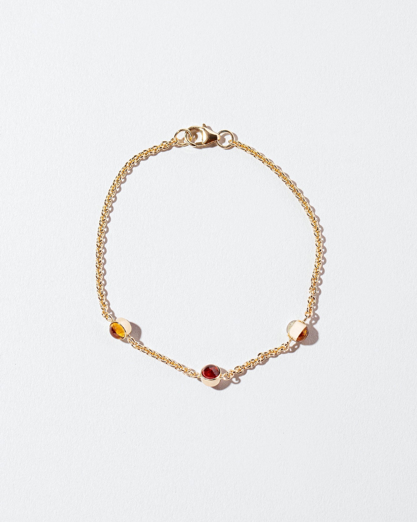 Birthstone Bracelet - Three Bezels on light color background.