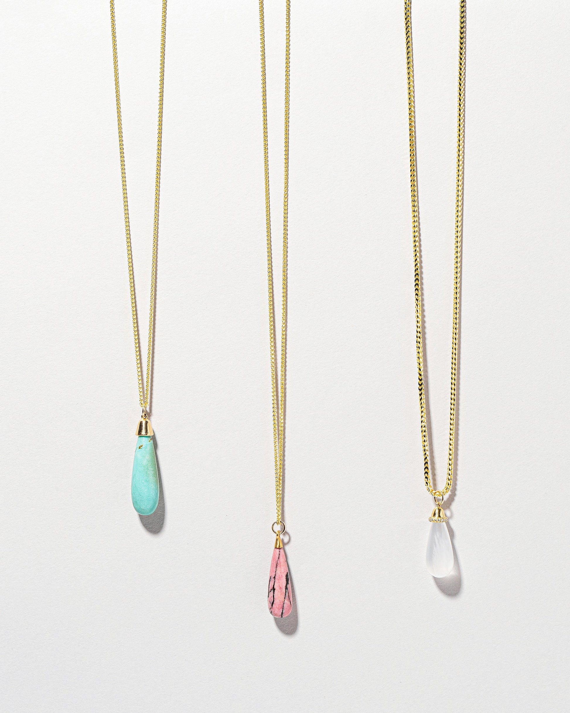 Rhodolite Drop Pendant on light color background.