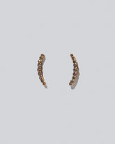 Crescent Ear Climber Stud Earrings - Cognac Diamond on light colored background.