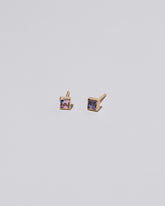 Square Stud - Pink Purple Sapphire on light color background.