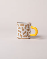 Recreation Center Yellow Mark Mug on light color background.