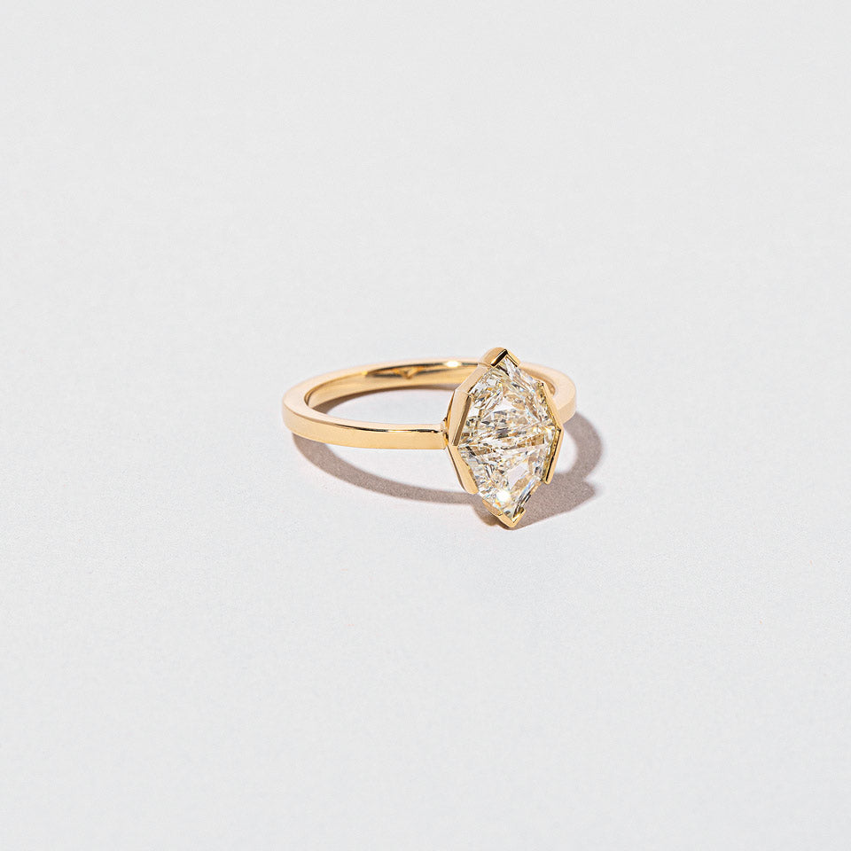 product_details::Closeup details of the Parallel Universe Ring on light color background.