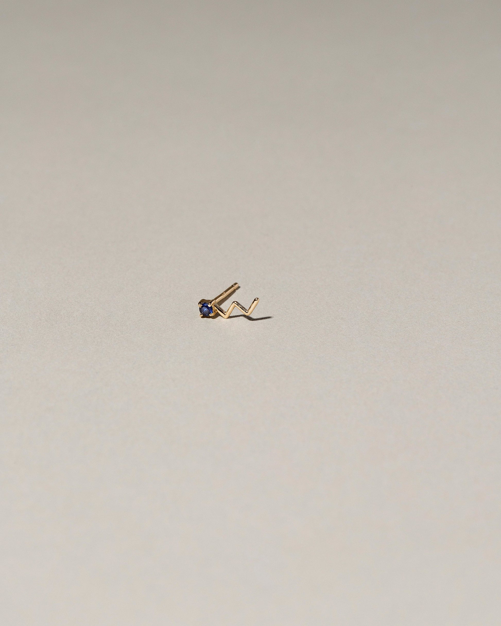 Lightning Single Stud on light color background.