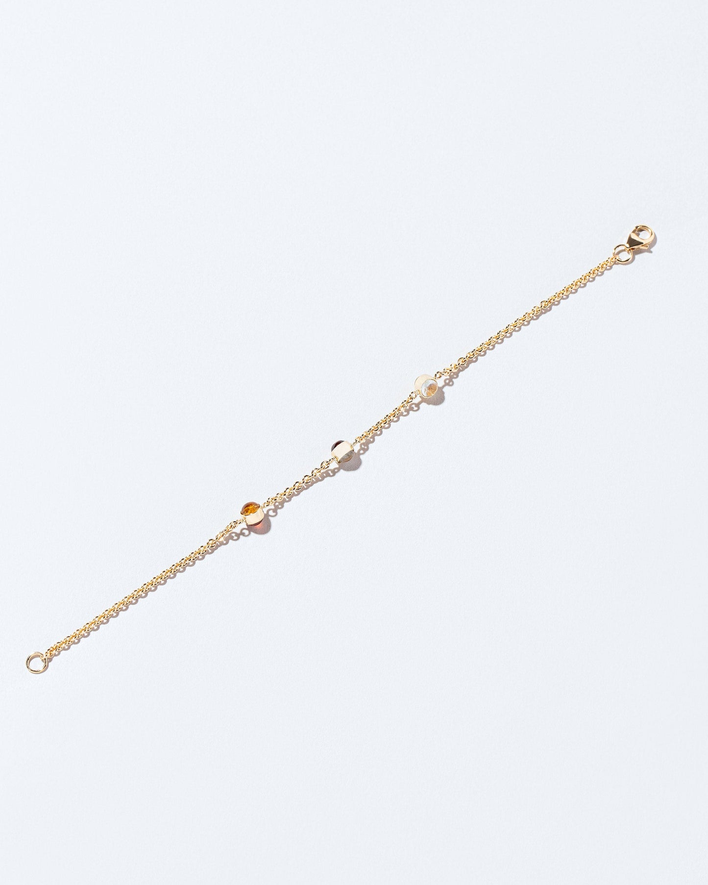 Birthstone Bracelet - Three Bezels on light color background.