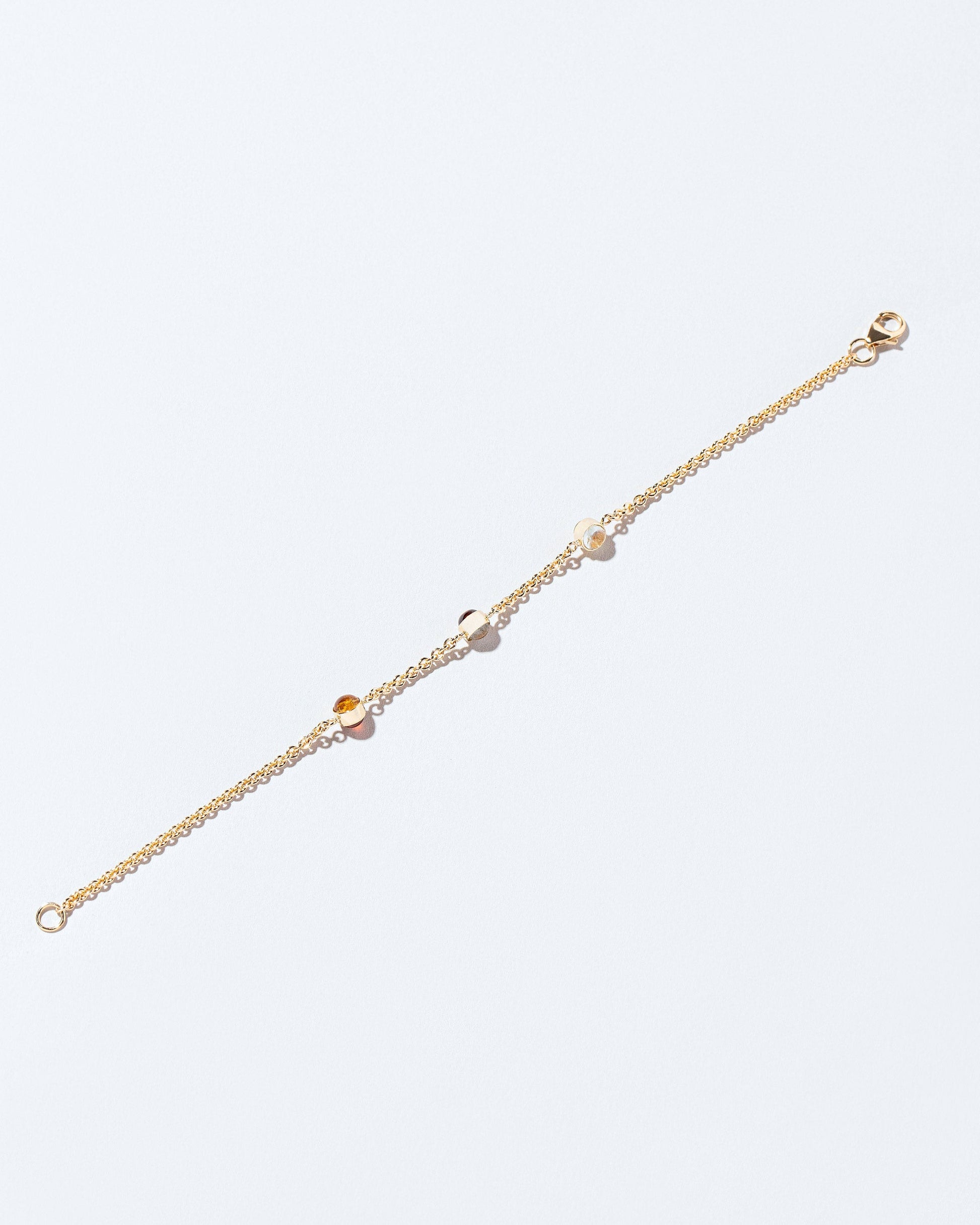 Birthstone Bracelet - Three Bezels on light color background.