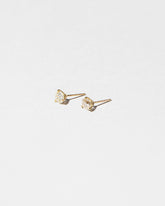 Martini Studs - White Diamond on light color background.