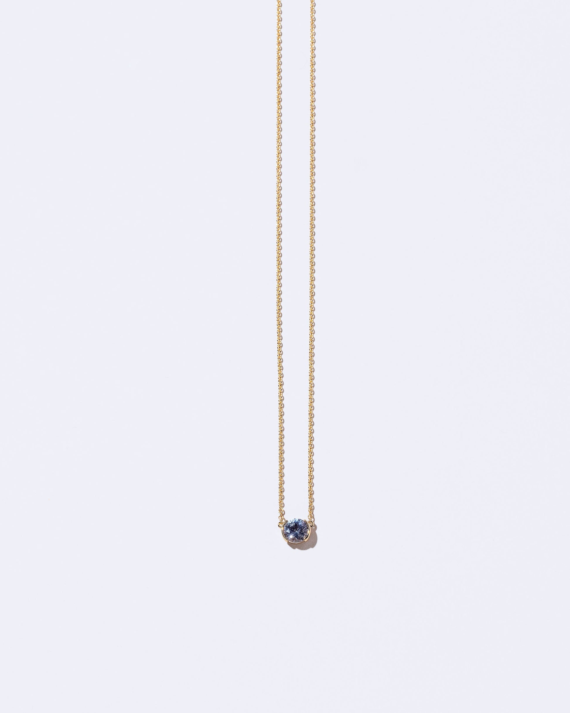 Occam's Necklace on light color background.