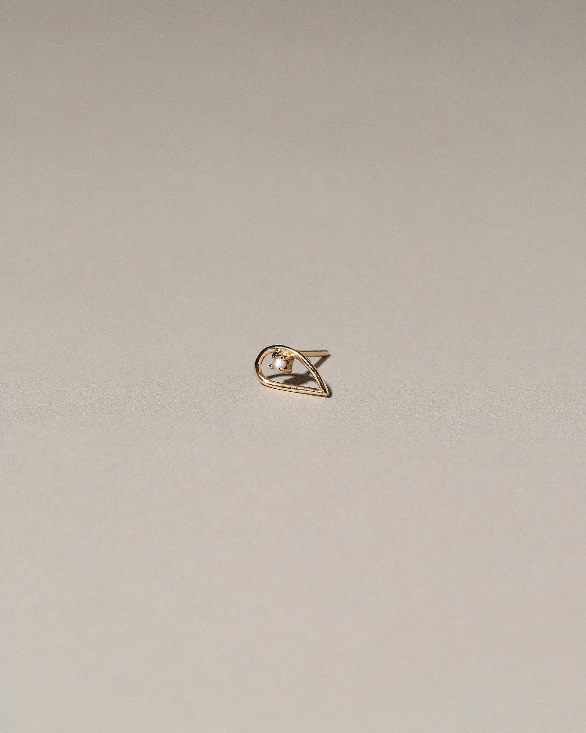 Sun Drop Single Stud on light color background.