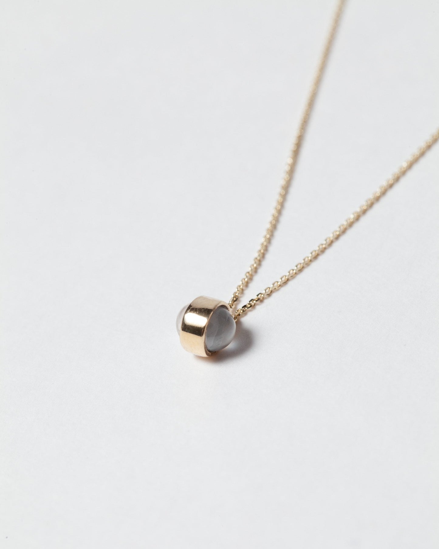 Birthstone Necklace on light color background.