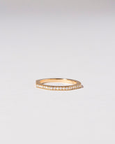Gold Pavé 1.7mm Segmented Half Hoop Band on light color background.
