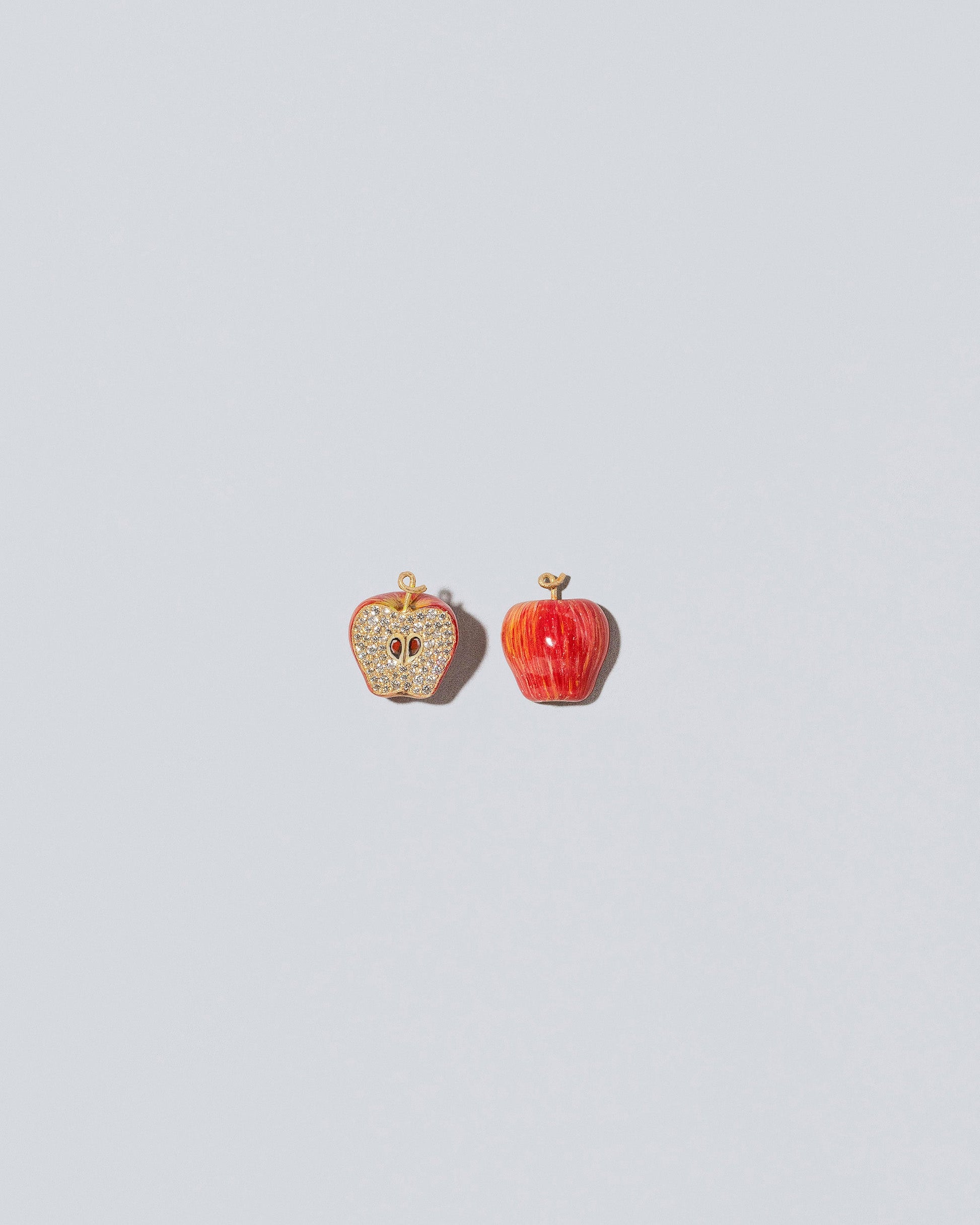 Red Apple Charm - Fulls on light color background.