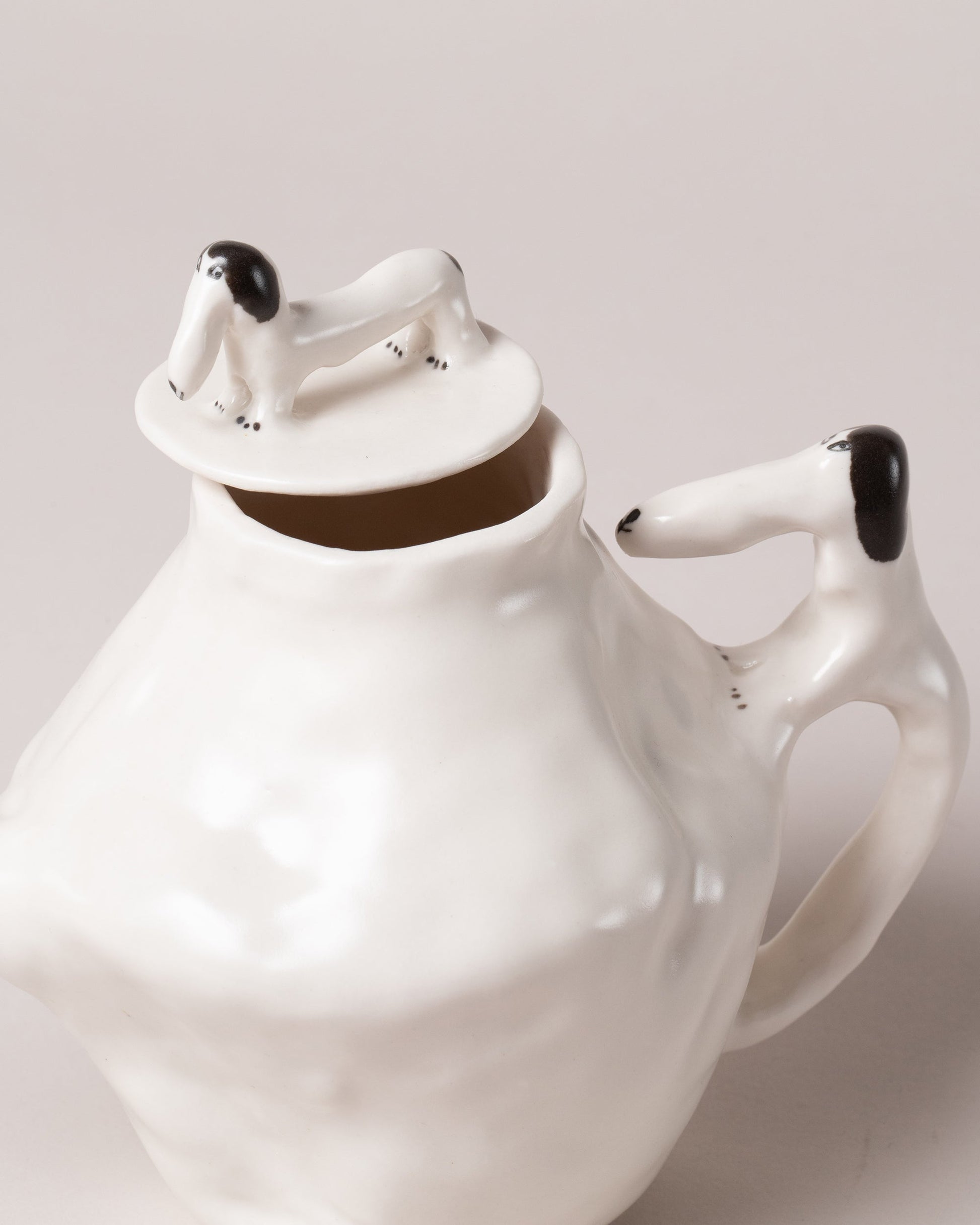 Closeup detail of the Eleonor Boström Plain Coffee Pot Dogs on light color background.