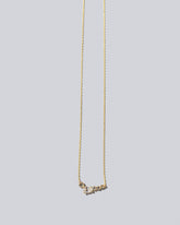 Teardrop Necklace - Diamonds on light color background.