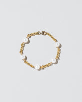 Five Pearl Station Bracelet Short Loop Chain on lightcolor background.