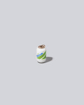 Mociun Soda Charm on light color background.
