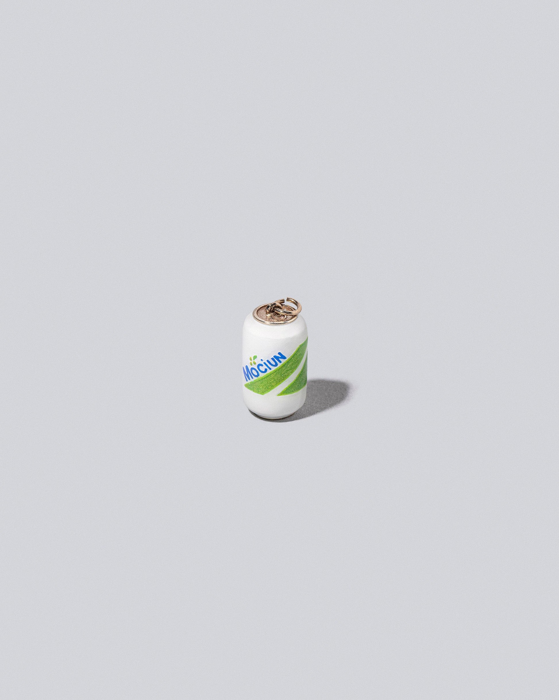 Mociun Soda Charm on light color background.