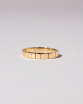 Gold 3mm Etched Lines Band on light color background.