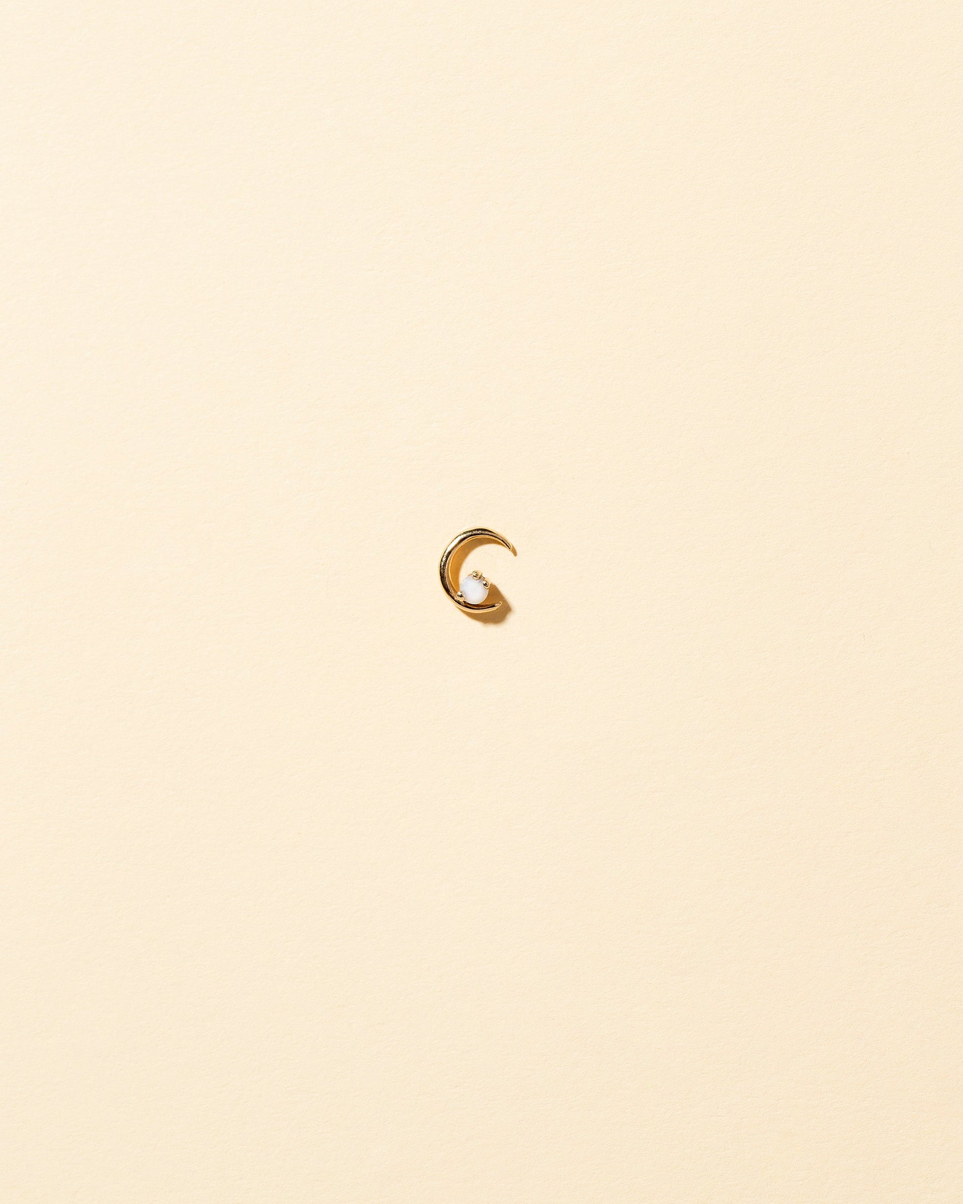 Right Opal Moon Ray Stud Earring Single on light color background.