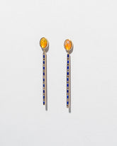 Ethiopian Opal Transformation Earrings on light color background.