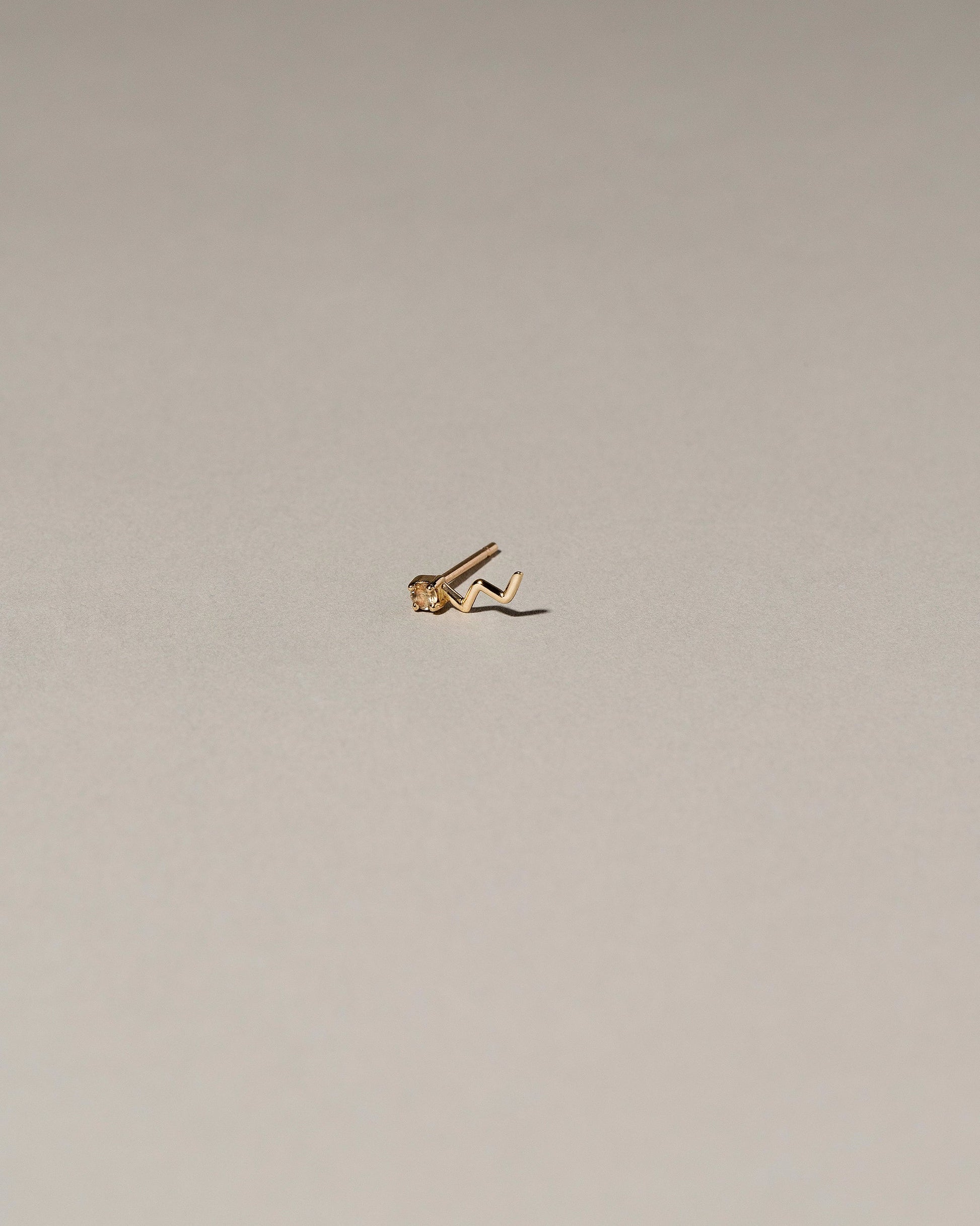 Lightning Single Stud on light color background.