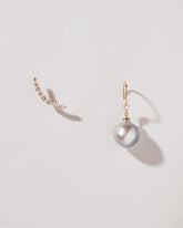 Moon Drop Earrings on light color background.