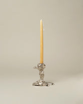 POLSPOTTEN Silver Small Drip Candle Holder on light color background.