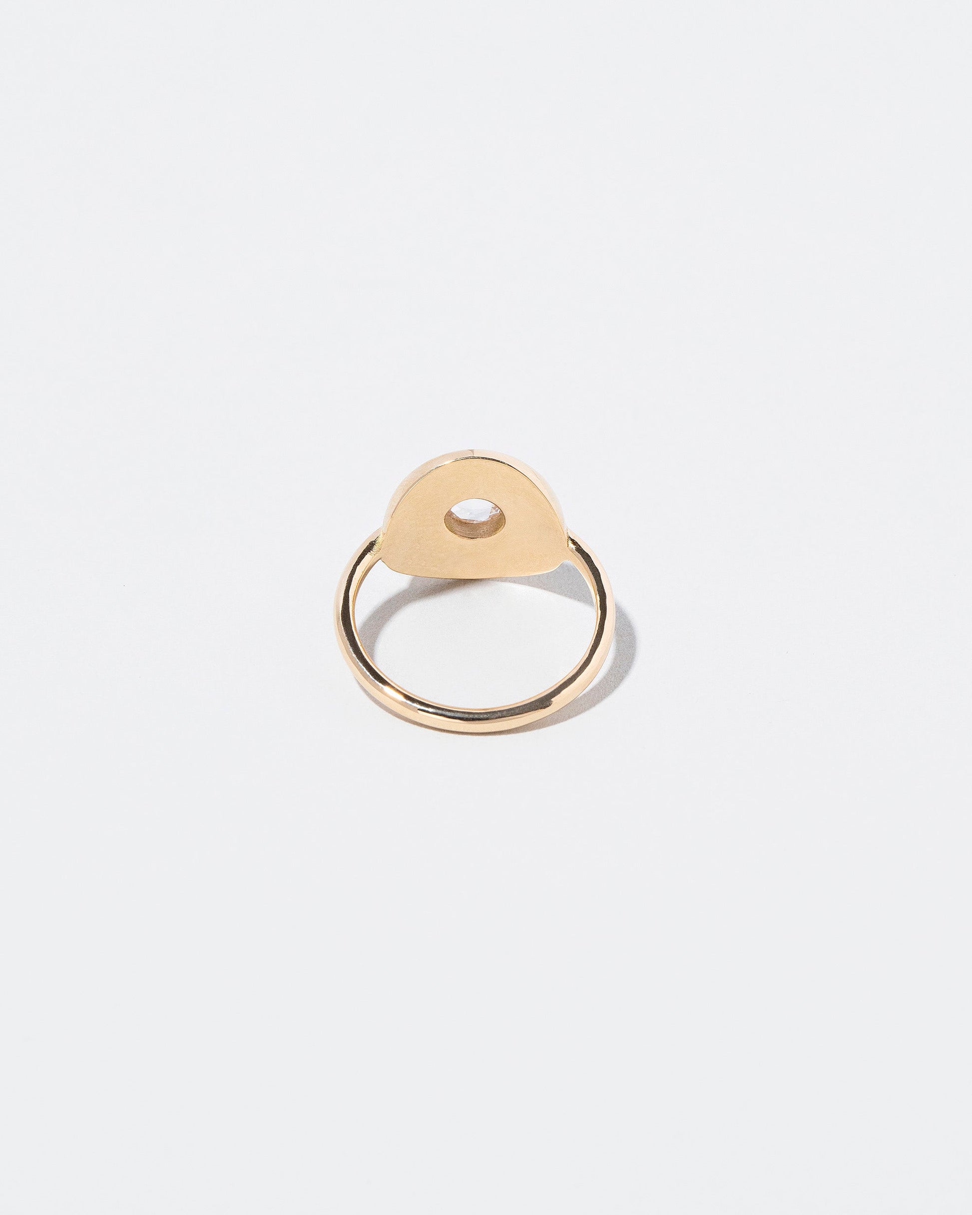 Petite Exposition Ring on light color background.