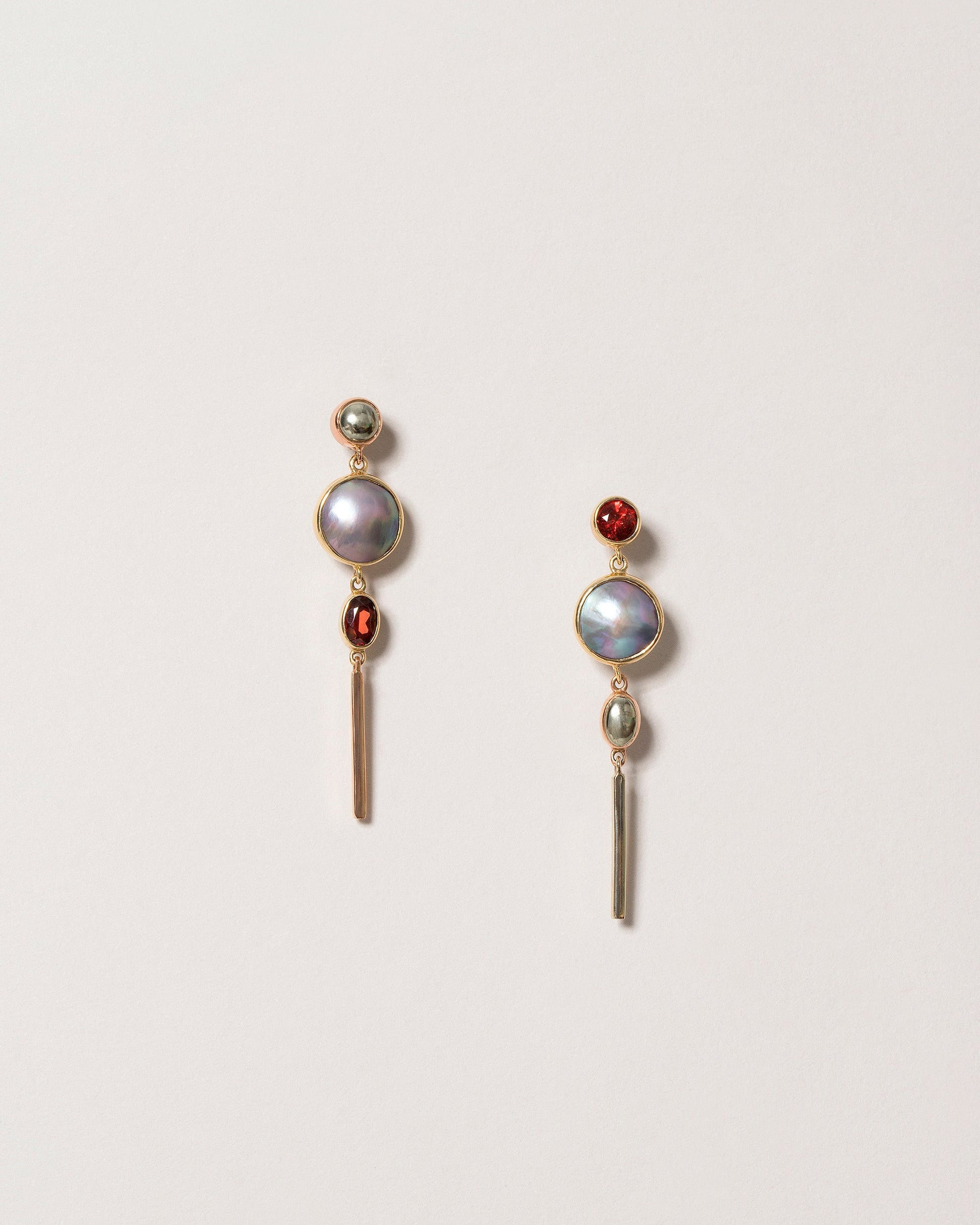 Act 2. Earrings 3 on light color background.