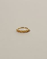 Eleven Trillion Ring - Yellow Sapphire on light color background.