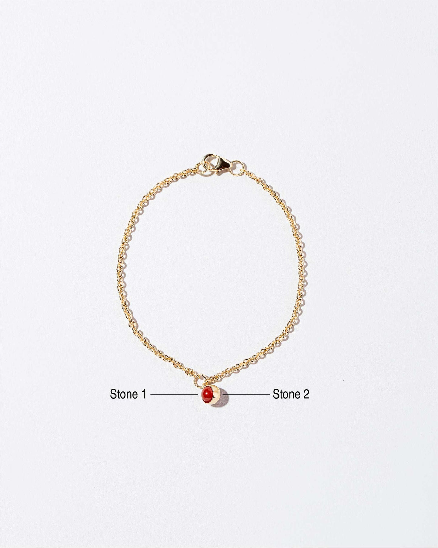 Birthstone Charm Bracelet on light color background.