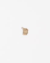 Toast Charm - with a Bite on light color background.