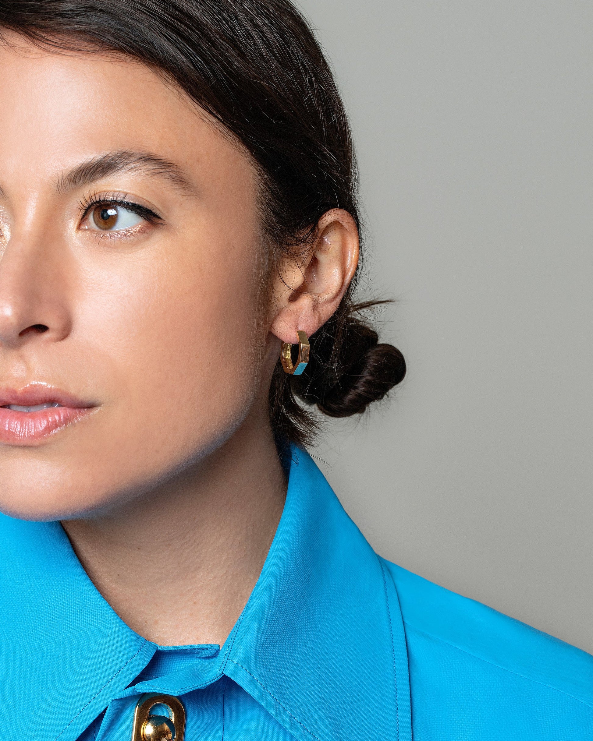 Gold Solid Segmented Hoop Earrings on model.