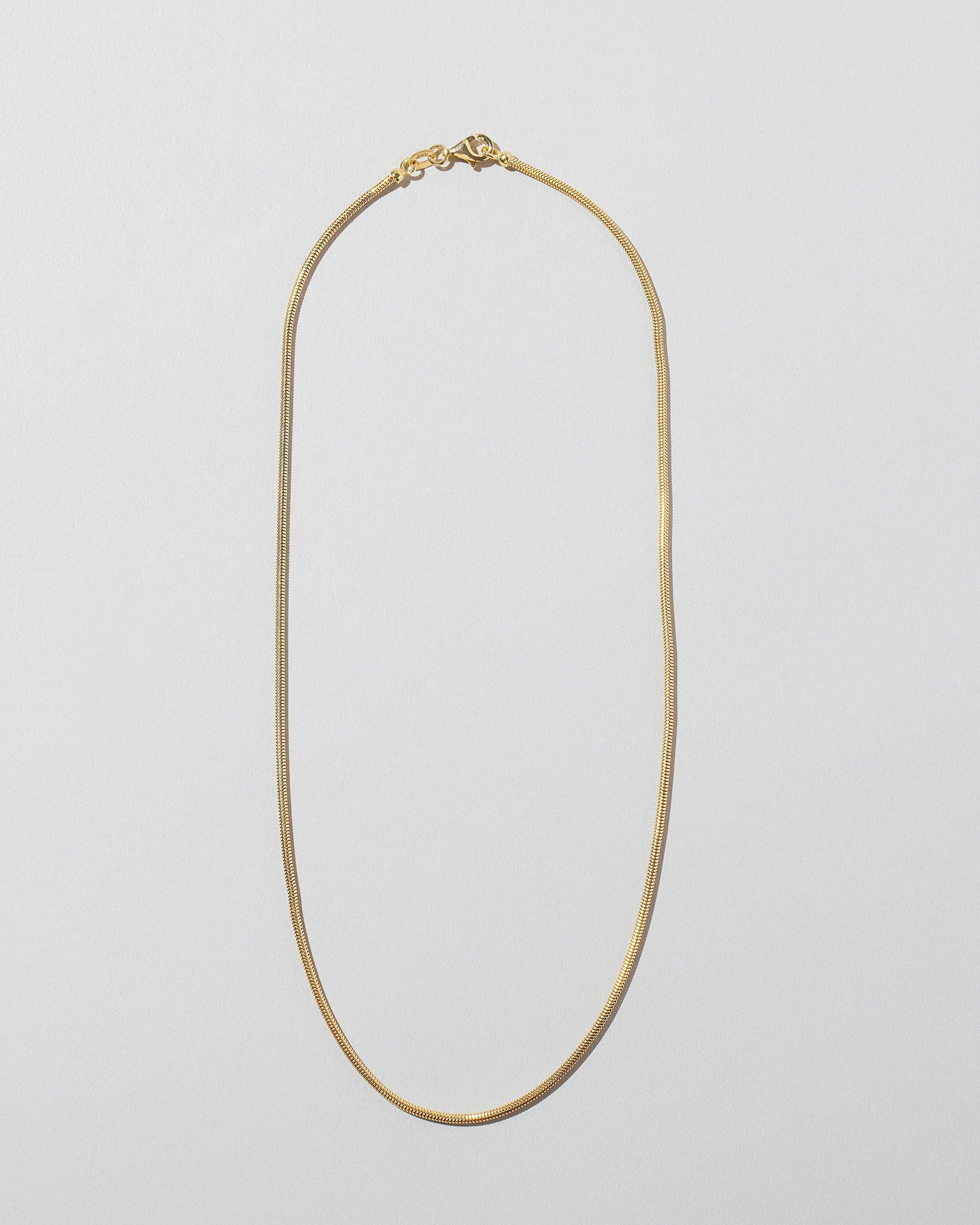 1.2mm Serpent Chain Necklace on light color background.