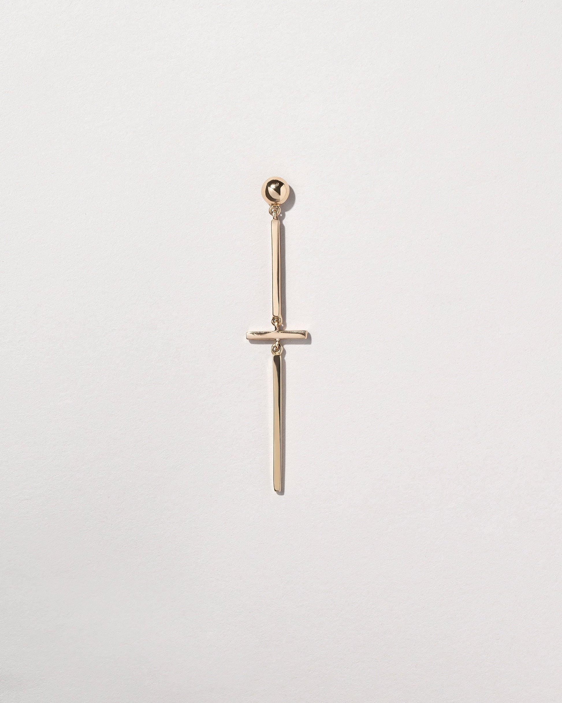 Act 2. Single Earring 7 on light color background.