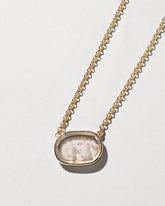Independence Intaglio Seal Necklace on light color background.