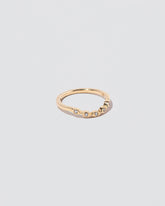 View from the side of the Gold Seeing Eye Band on light color background.