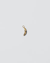 Bruised Banana Charm on light color background.