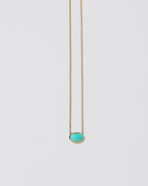 Heaven & Earth Necklace on light color background.