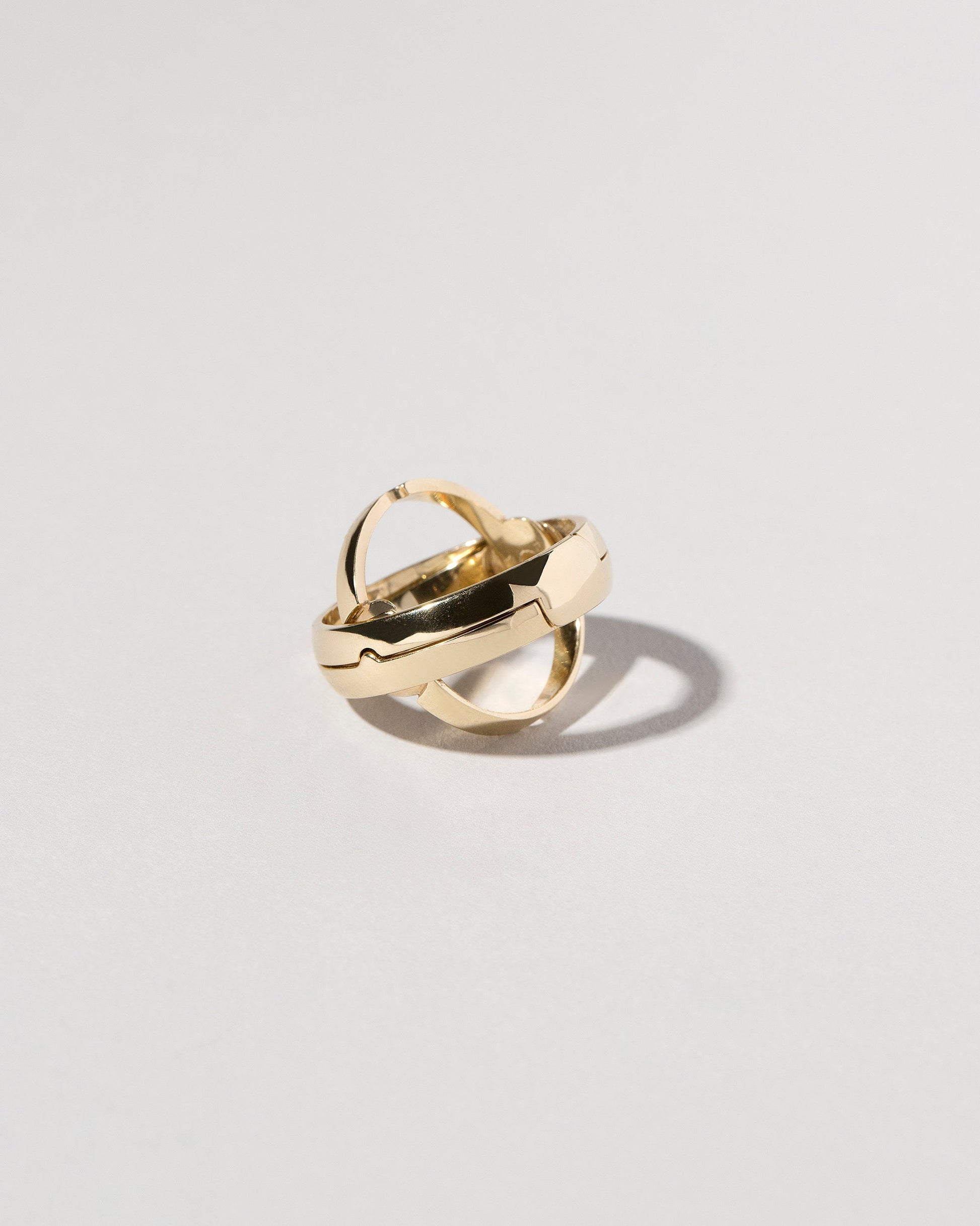 Detail view of the Armillary Sphere Band on light color background.