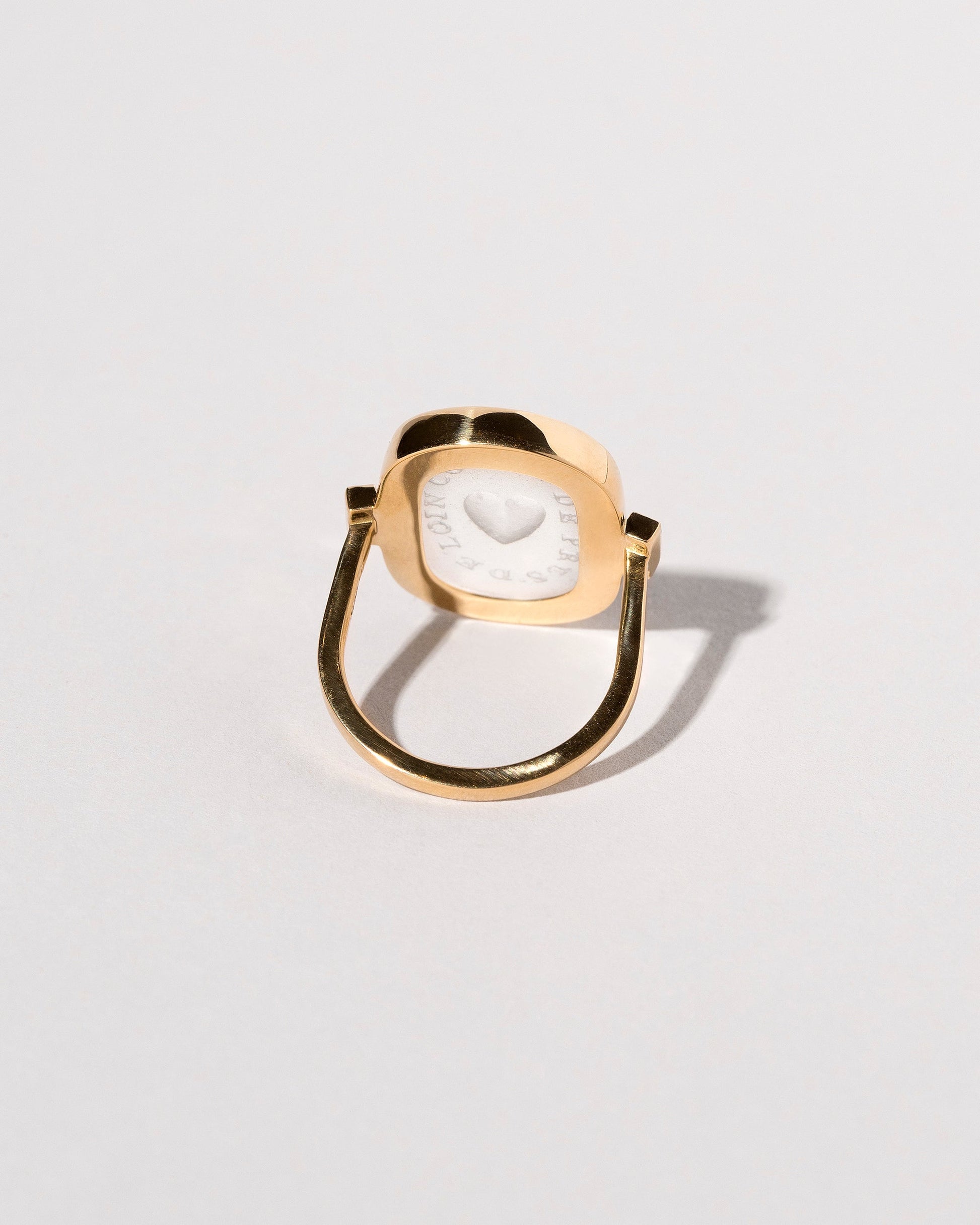 View from the back of the Long Distance Intaglio Seal Ring on light color background.