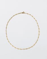 Twisted Chain Necklace on light color background.