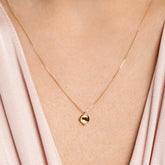 Pearl Cup Necklace on model.