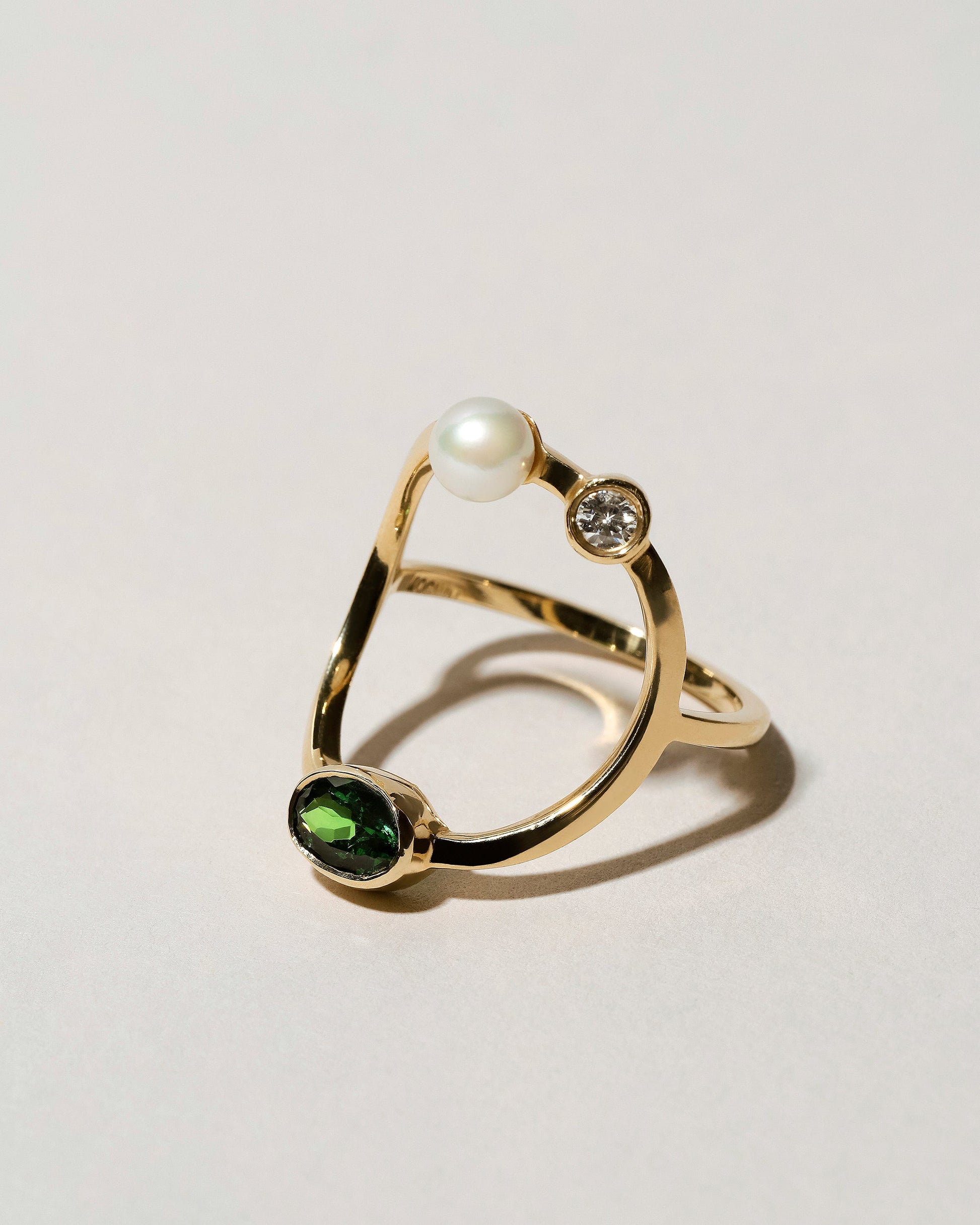 Trilogy Ring - Tsavorite on light color background.