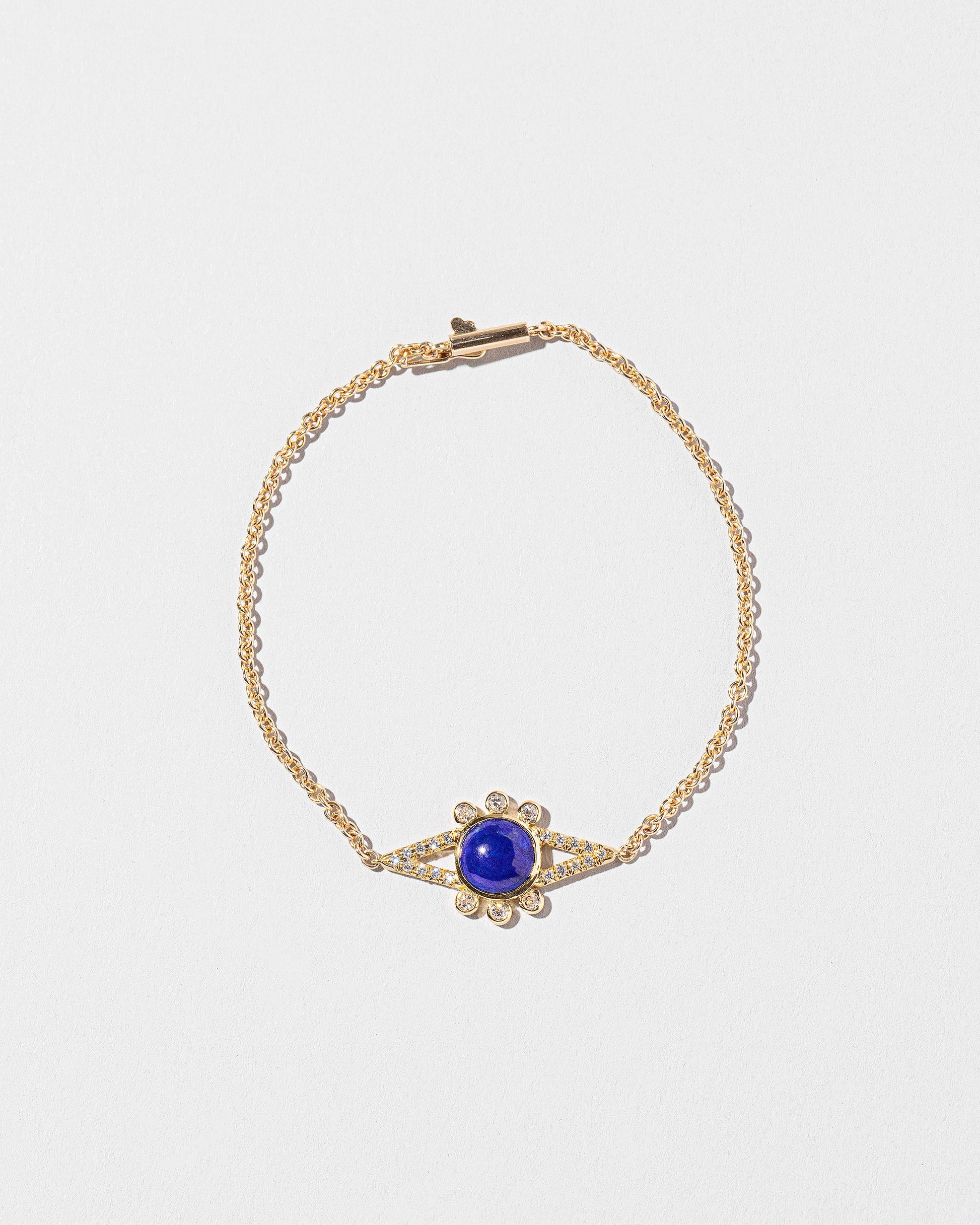 Lapis & Diamond Eye Bracelet on light color background.