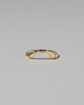 Gold Three Stone Blue Sapphire Curve Band on light color background.