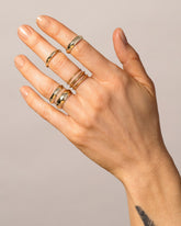 Gold Knife Edge Bands on model.